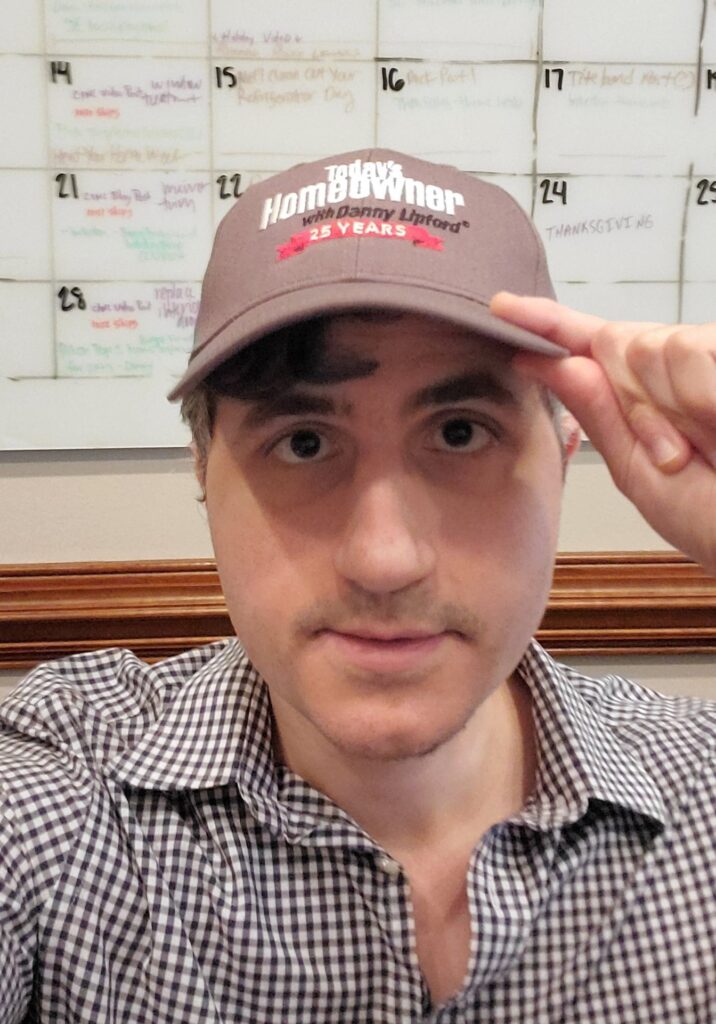 Thomas Boni, wearing a Today's Homeowner ball cap in the TH conference room in Mobile, Alabama.